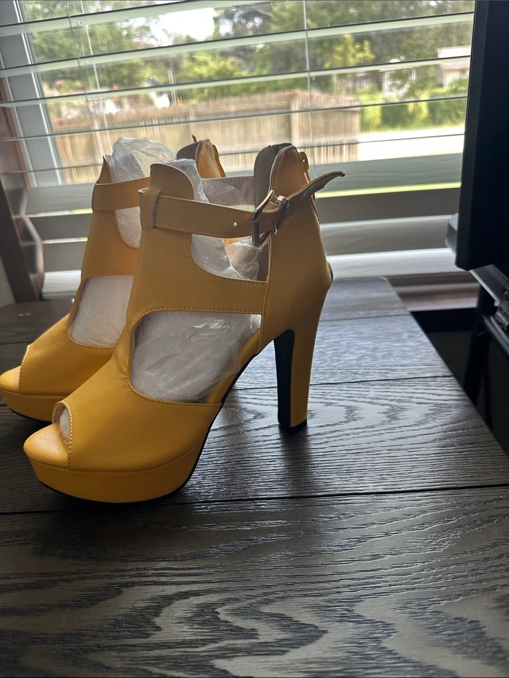 Fereshte mustard yellow peep toe high heel ankle booties.